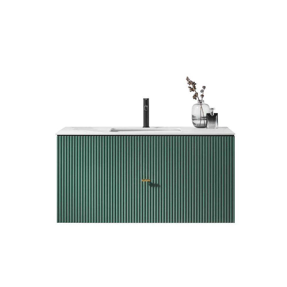 Minimalist Barcelona 42 Inch Wall Mount Bathroom Vanity featuring a green ribbed cabinet, white countertop, black faucet, and a glass vase with dried branches on the right, set against a plain white background.