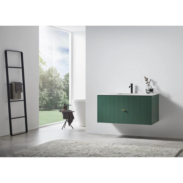 Minimalist bathroom with a Barcelona 42 Inch Wall Mount Bathroom Vanity in green, modern faucet, and striped cabinet. Large window reveals greenery outside. Ladder-style towel rack and freestanding bathtub complete the serene space.