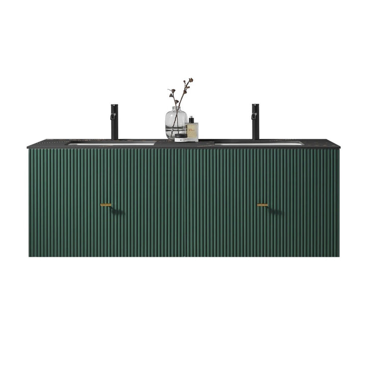 The Barcelona 60 Inch Wall Mount Double Bathroom Vanity With Top features a matte black countertop, dark green fluted cabinet doors, two sleek black faucets, and a small vase with branches placed between the sinks.