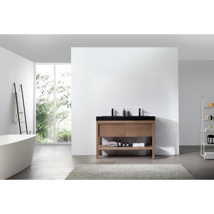 A modern bathroom features a freestanding tub, Bibury 48 Inch Double Bathroom Vanity with Top, ladder towel rack, open shelving stocked with toiletries, and a large window allowing in natural light.
