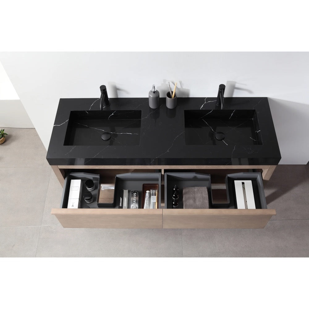 The Bibury 60 Inch Double Bathroom Vanity with Top showcases a modern black double sink countertop, two black faucets, and open wooden drawers with toiletries and accessories, all elegantly viewed from above.