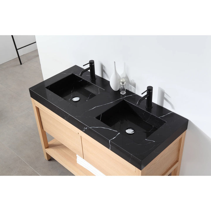 The Bibury 48 Inch Double Bathroom Vanity with Top features a black marble countertop, black faucets, and a light wood base, set against a white wall for a sleek modern look.