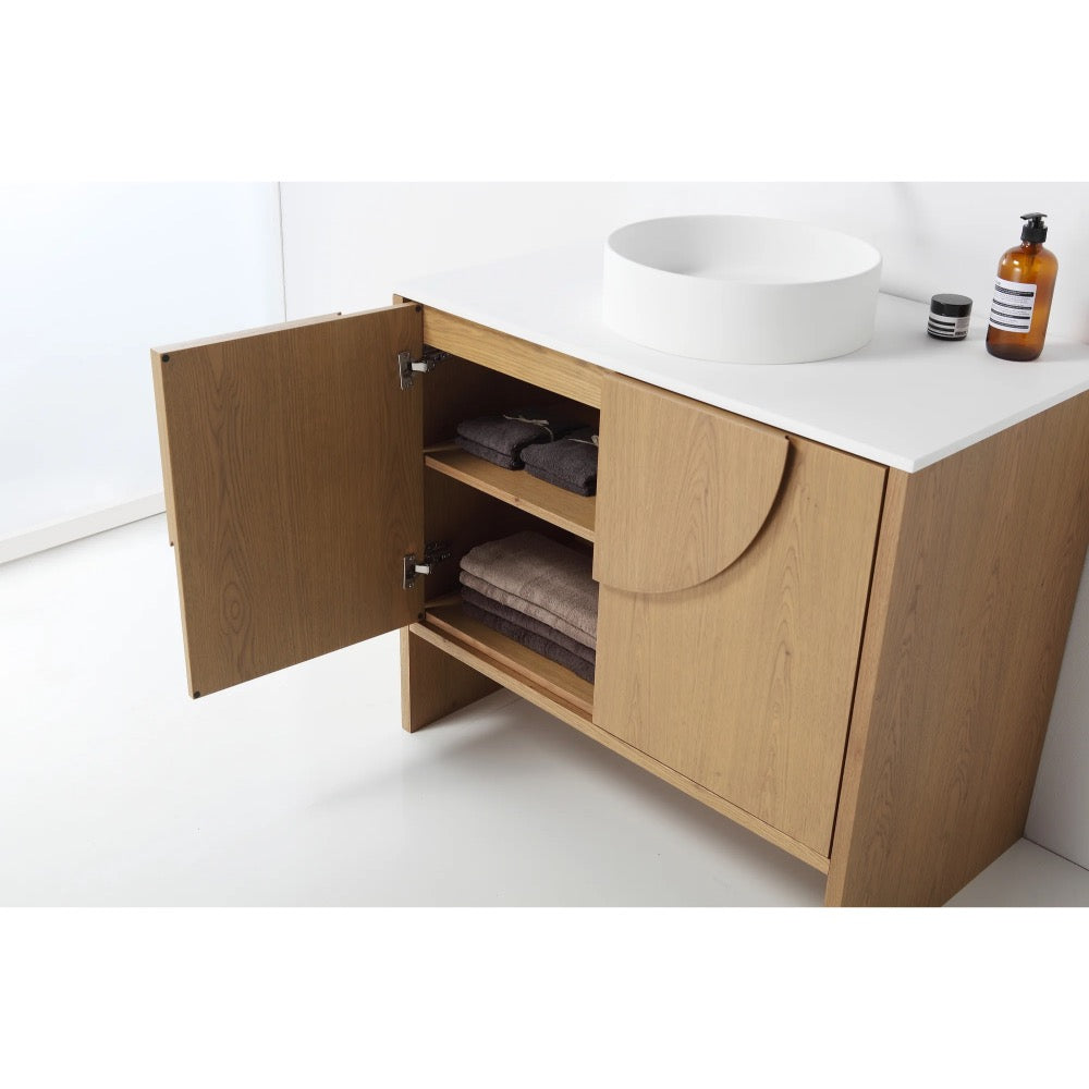 The Celle 36 Inch Bathroom Vanity With Vessel Sink features a white countertop, round vessel sink, one cabinet door revealing towels and toiletries, plus a soap dispenser and containers on top.