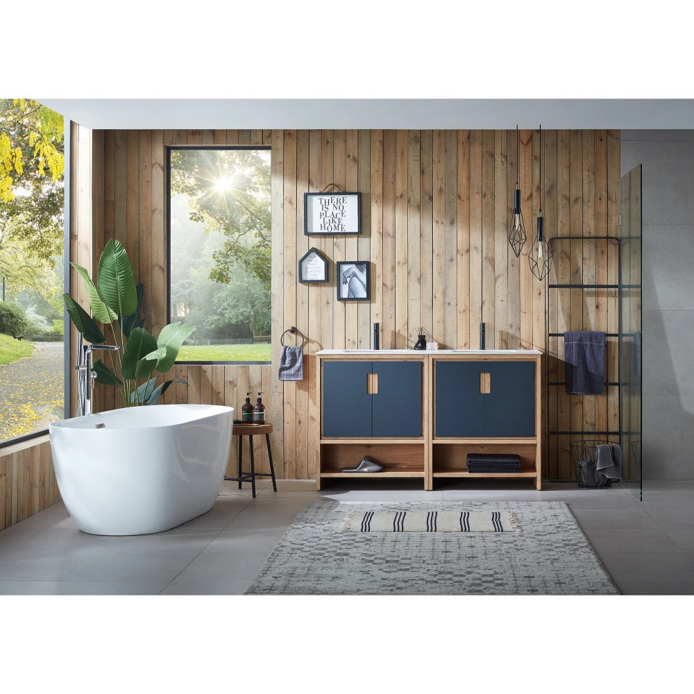 Modern bathroom with a freestanding white tub, wood-paneled wall, and a Lyon 60 Inch Double Bathroom Vanity with Top. Sunlight streams through the large window, highlighting blue cabinets, an indoor plant, pendant lights, and a patterned rug.