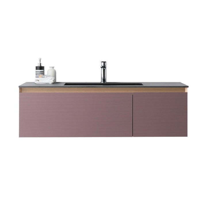 The Oslo 48 Inch Wall Mount Bathroom Vanity showcases a ribbed mauve front, dark countertop, integrated sink, chrome faucet, and left-side soap dispensers for a sleek modern look.