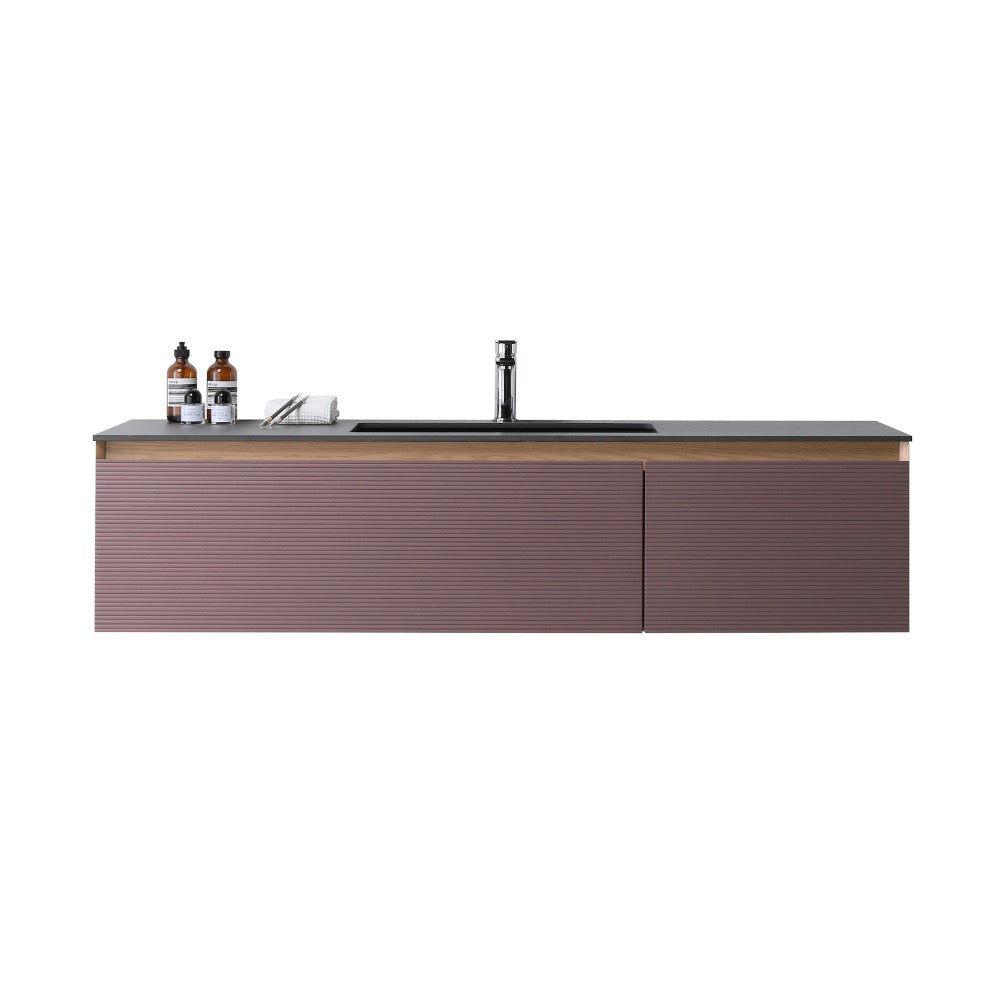 The Oslo 60 Inch Wall Mount Single Bathroom Vanity features a ribbed mauve front, black countertop, and built-in sink. Two bottles and a small towel on the left side add style and function to your modern bathroom.