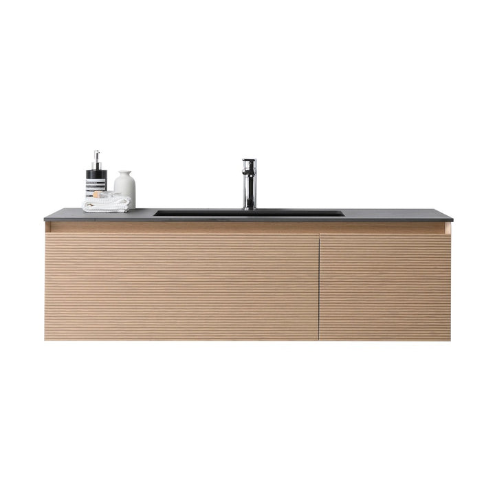 The Oslo 48 Inch Wall Mount Bathroom Vanity boasts a ribbed light wood finish, black countertop, integrated sink, chrome faucet, and left-side containers for soap and lotion.