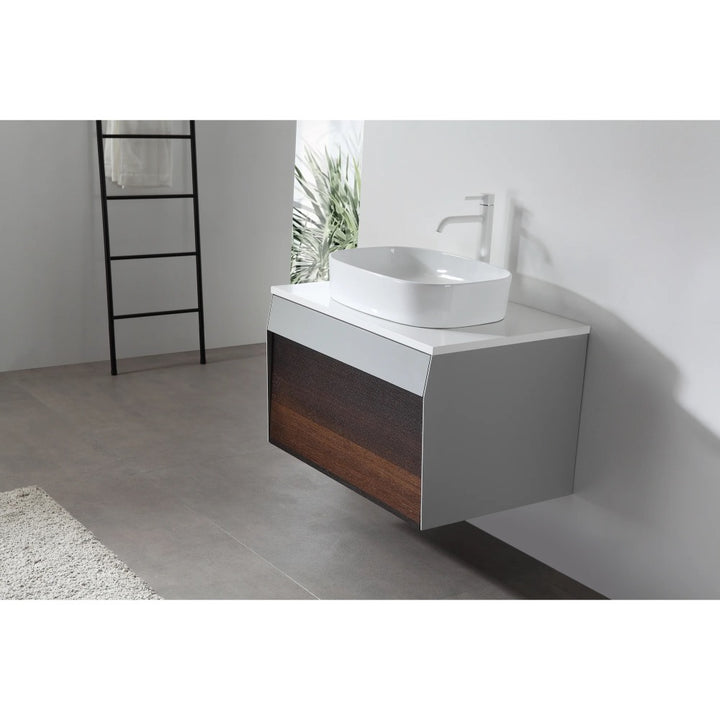 Modern bathroom with a Ronda 30 Inch Wall Mount Bathroom Vanity featuring a white countertop, vessel sink, and wood-accented drawer. Minimalist decor includes gray floor tiles, white walls, and a black ladder-style towel rack.