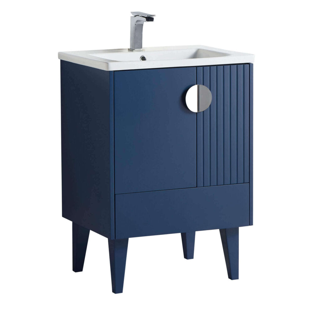 The Venezian 24 inch Bathroom Vanity With Sink has a modern navy blue finish, white sink, chrome faucet, angled legs, and a single cabinet door with a round silver handle and vertical grooves.