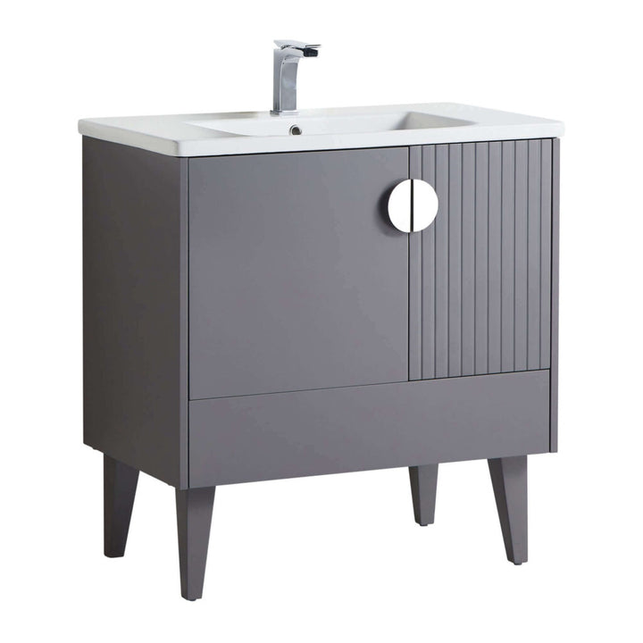 The Venezian 30 inch Bathroom Vanity With Sink showcases a modern gray finish, tapered legs, a white rectangular sink, chrome faucet, round cut-out handle, and vertical grooves on one cabinet door.