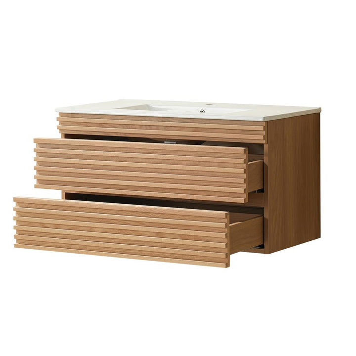 The Linea 36 Inch Wall Mounted Bathroom Vanity features a modern wooden design, a white countertop, and two wide drawers with horizontal slat fronts for stylish appeal and ample storage.