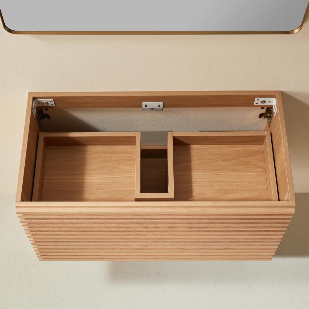 The Linea 36 Inch Wall Mounted Bathroom Vanity is crafted in wood with an open top and divided inner storage, elegantly displayed from above against a beige wall and floor.