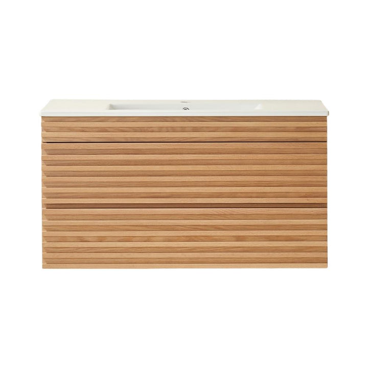 The Linea 36 Inch Wall Mounted Bathroom Vanity features a white rectangular sink and a wooden cabinet with horizontal slats. Its minimalist design complements any space, set against a plain white background.
