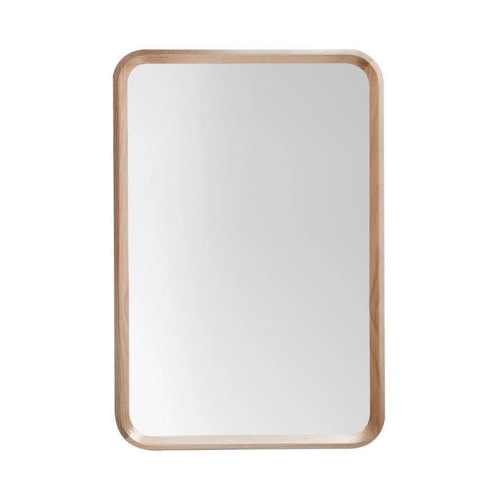 A rectangular mirror with rounded corners and a light wooden frame by Vela Mirrors, shown on a plain white background.