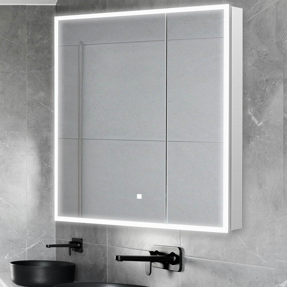 A modern bathroom features the Edge Royal 30 Inch LED Lighted Mirror Medicine Cabinet above a matte black sink and faucet, all set against gray tiled walls.