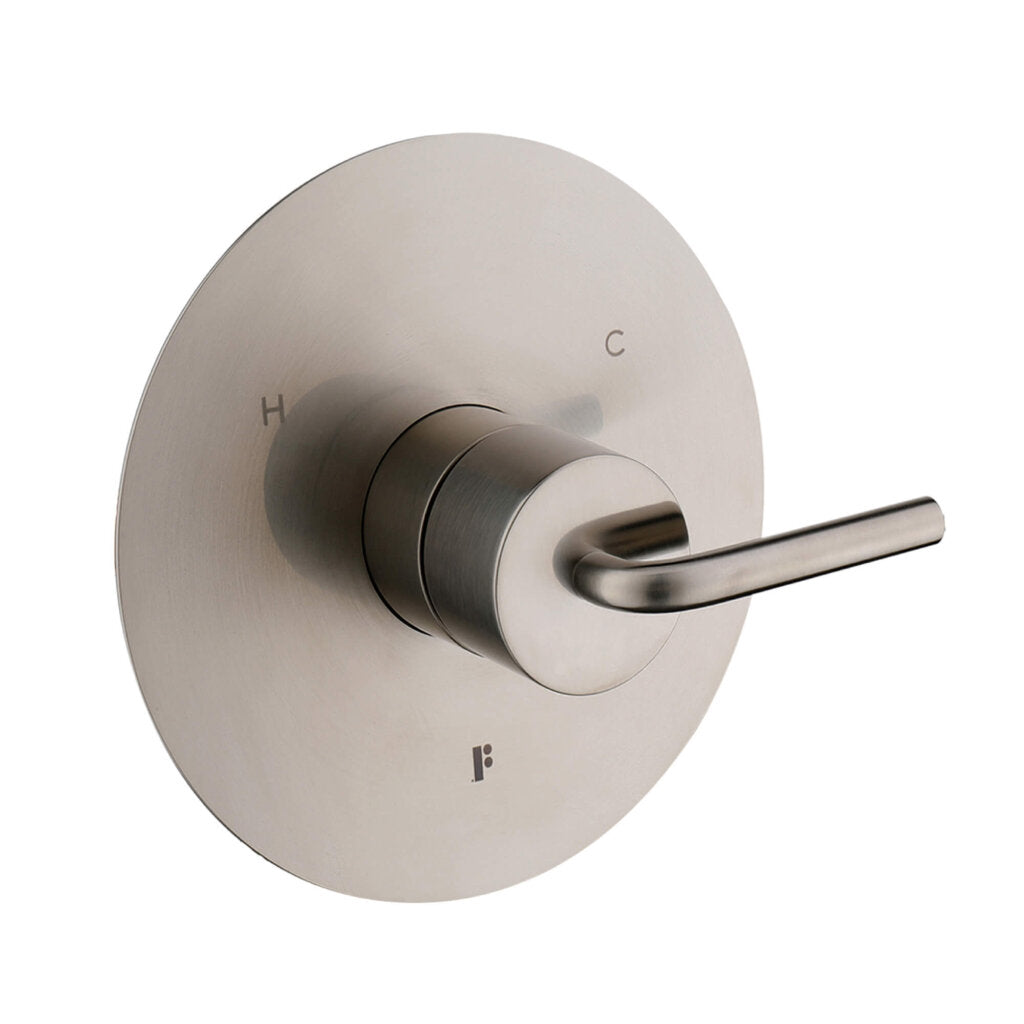 The GeoFlow Round Shower System features a brushed metal valve handle on a round plate, with H and C engraved beside the base to indicate hot and cold water.