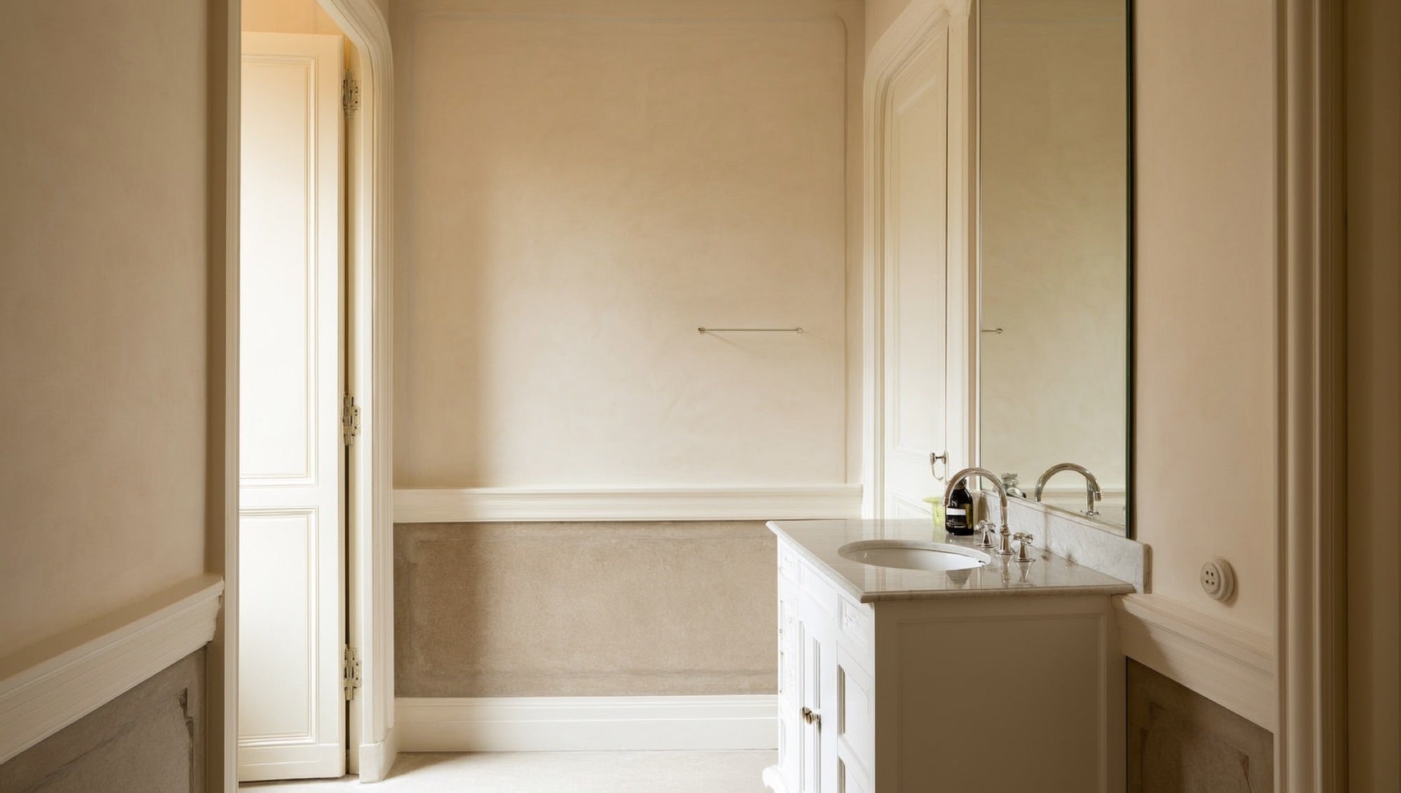 White shaker vanity with ceramic top and chrome faucet