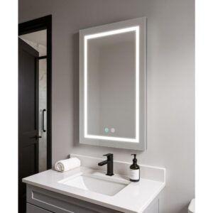 A modern bathroom vanity features the Daytona 24 Inch x 30 Inch LED Lighted Bathroom Mirror above a white sink with black faucet, rolled towel, and soap dispenser on a light gray countertop, with a black door and tiled shower in the background.