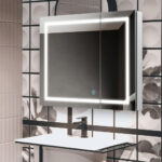 A modern bathroom features a Royale Plus 36 Inch x 30 Inch LED Lighted Mirror Medicine Cabinet above a white sink with a black faucet, set against geometric and floral patterned tiles on the background wall.