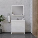 Modern bathroom with a white vanity, silver handles, a rectangular mirror above, small white accessories, a hand towel on a ring, a potted plant on the left, and gray tile floor. Walls are a mix of concrete and wood paneling.