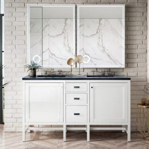 A modern bathroom features the Addison 60 inch Double Bathroom Vanity in Glossy White with black countertops, flanked by two mirrors on marble-patterned walls. The decor includes a large plant, decorative stool, round side table with a candle, and an arched window view.
