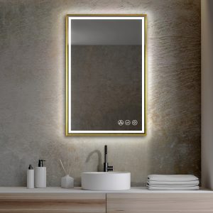 A contemporary bathroom features the Stellar 18 Inch LED Light Bathroom Mirror, framed in gold and mounted on a textured wall. Below, a round white sink with a black faucet is beautifully accented by soap dispensers, a reed diffuser, and neatly stacked towels.