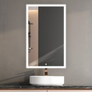 A modern bathroom features the Edge Royal 24 Inch Left Side LED Lighted Mirror Medicine Cabinet, its illuminated LED border casting a soft glow. A round white sink sits below, while the mirror reflects a shower area with a shelf on the left.