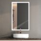 A modern bathroom features the Edge Royal 24 Inch Left Side LED Lighted Mirror Medicine Cabinet, its illuminated LED border casting a soft glow. A round white sink sits below, while the mirror reflects a shower area with a shelf on the left.