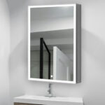 The Edge Royal 24 Inch Left Side LED Lighted Mirror Medicine Cabinet is mounted above a sink and faucet, reflecting a shower area with a black-framed glass door and white walls.