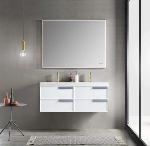 A modern bathroom features the Sofia 48 inch Double Wall Mount Bathroom Vanity in Matte White, topped with a large rectangular mirror and four drawers. A gray rug lies beneath, while a small table on the left holds decor under a pendant light. Large right-side windows fill the space with natural light.