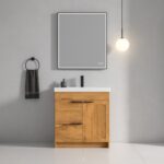 A modern bathroom features the Hanover 30 inch Bathroom Vanity With Sink, topped with a white countertop, paired with a square mirror, black soap dispenser, dark towel on a ring, round pendant light, and set against a gray wall.