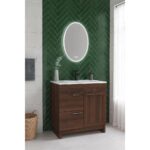 Bathroom featuring the Hanover 36 inch Bathroom Vanity With Sink, white countertop, oval LED mirror on a green herringbone-tiled wall, towel on the left, wicker basket on the floor, and sheer curtains over the window.