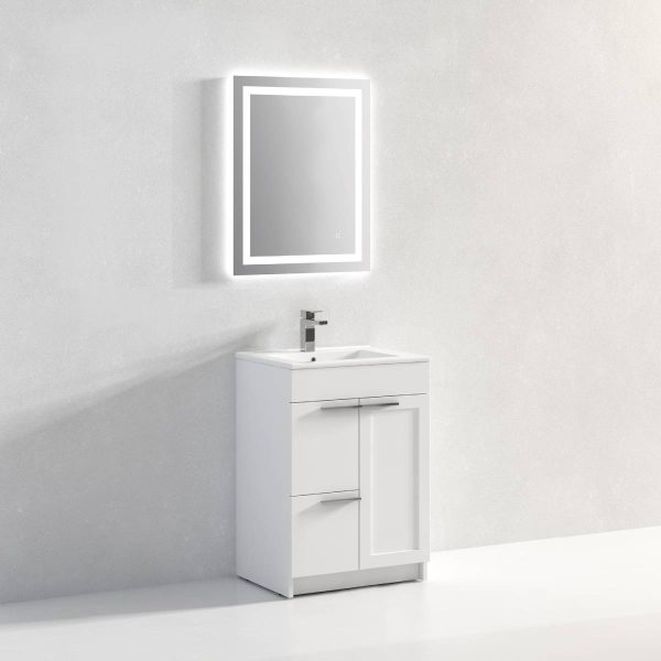 A minimalist bathroom features the Hanover 24 inch Bathroom Vanity in Matte White with a sleek countertop, a faucet, and drawers. A rectangular mirror with bright LED backlighting is mounted on the light gray wall above it.