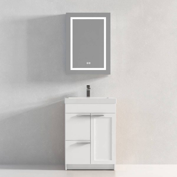 The Hanover 24 Bathroom Vanity in Matte White features a sleek cabinet with an integrated sink and modern silver faucet. A gray-framed rectangular mirror on the plain light gray wall enhances its understated elegance.