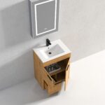 The Hanover 24 inch Bathroom Vanity With Sink includes a white basin, black faucet, and wooden cabinet with open doors and drawer showing shelves with bottles, plus a sleek rectangular mirror above on a light gray wall.