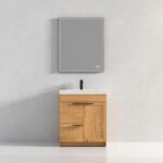 The Hanover 30 inch Bathroom Vanity With Sink showcases a minimalist design with a light wood cabinet, white countertop, black faucet, and a large rectangular mirror set against a plain light gray wall.