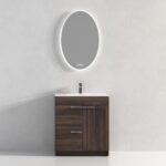 The Hanover 30 inch Bathroom Vanity With Sink has a dark wood cabinet, white countertop, and single faucet, and is placed below an oval backlit mirror on a light gray wall.