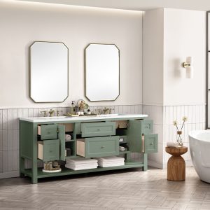 A modern bathroom with a Breckenridge 72" Double Bathroom Vanity in Smokey Celadon with White Zeus Top, open drawers and cabinets, two rectangular mirrors, towels on the lower shelf, light wall tiles, and a freestanding tub on the right.