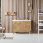 A modern bathroom with a Nara 48 inch Pecan Oak Freestanding Bathroom Vanity, lattice cabinet doors, white countertop, wall shelves, and gold fixtures set against a wood slat wall. Towels and toiletries are on a white rack.