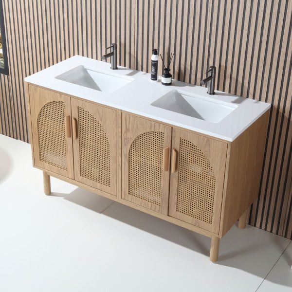 The Nara 60 inch Freestanding Bathroom Vanity in Pecan Oak boasts a modern double-sink design, white countertop, wood base, and four doors with woven rattan panels, perfect against a vertical wood-striped wall.