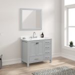 A modern bathroom with the Geneva 36 inch Bathroom Vanity in Metal Gray, featuring a Carrara marble countertop and cabinet storage. Above is a matching framed mirror, with a soap dispenser and small plant on the counter near the window.