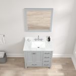 A top-down view of the Geneva 36 inch Bathroom Vanity in Metal Gray with Carrara marble countertop, rectangular sink, silver faucet, soap dish, and pump bottle. A square mirror is above, with towel and basket on the light wood floor.