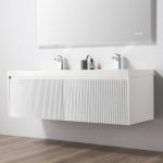 The Positano 60 inch Double Sink Wall Mount Bathroom Vanity in Matte White with Acrylic Top features two chrome faucets, a minimalist mirror above, and small toiletries on the countertop, set against a plain white wall and wooden floor.
