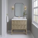 Modern bathroom with a geometric wood vanity, rectangular sink, gold faucet, and hexagonal mirror. Two wall sconces with round bulbs flank the mirror. A towel hangs on the left wall and a window is on the right.