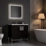 A modern bathroom with dark walls, a backlit square mirror above a sleek Shawbridge 30 inch Modern Bathroom Vanity With Sink, a white freestanding tub, a floor lamp with beige shade, and marble wall accents.