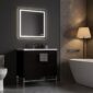A modern bathroom with dark walls, a backlit square mirror above a sleek Shawbridge 30 inch Modern Bathroom Vanity With Sink, a white freestanding tub, a floor lamp with beige shade, and marble wall accents.
