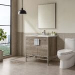 Modern bathroom with a large window, Shawbridge 36 inch Modern Bathroom Vanity With Sink, white toilet, pendant light, potted plants, and neutral tile floors and walls. Natural light fills the space.