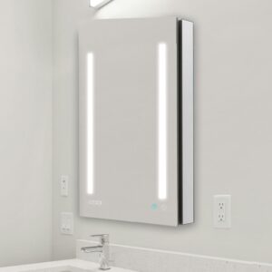 The Signature Royale 24"x36" Right Sided LED Lighted Mirror Medicine Cabinet features two vertical LED strips, a digital clock, and touch controls, perfect for mounting above a white countertop with sink and faucet.