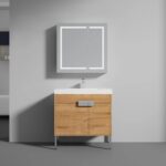 The Bari 36 inch Modern Bathroom Vanity With Sink features a light wood cabinet, white countertop with faucet, and a wall-mounted LED mirrored cabinet, all set against a plain light gray wall.