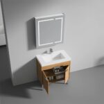 The Bari 36 inch Modern Bathroom Vanity With Sink features a rectangular white basin, a wooden cabinet with open doors showing toiletries, and a wall-mounted mirror in a minimalist bathroom with neutral walls and flooring.